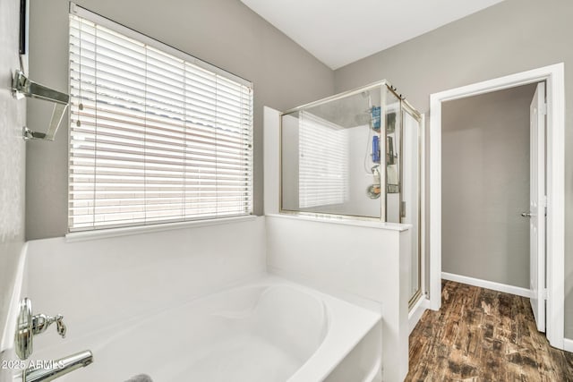 16917 W Sonora St, Goodyear, AZ 85338 - full bath featuring a garden tub, a stall shower, and wood finished floors