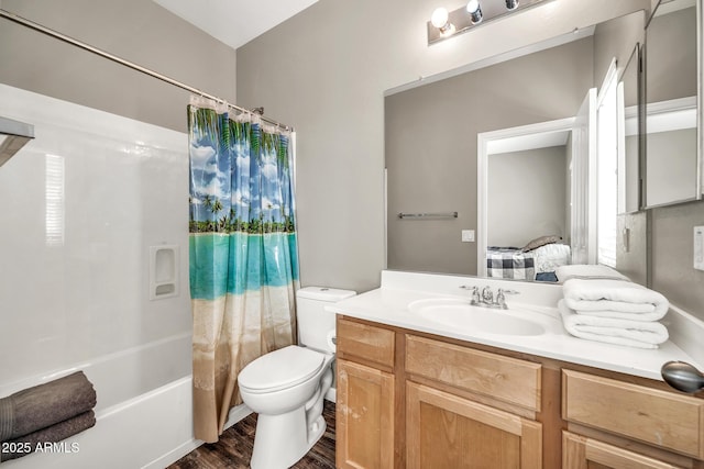 16917 W Sonora St, Goodyear, AZ 85338 - ensuite bathroom featuring vanity, shower / bath combo with shower curtain, and wood finished floors
