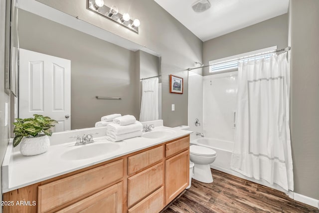 16917 W Sonora St, Goodyear, AZ 85338 - bathroom with double vanity, shower / bath combination with curtain, and wood finished floors