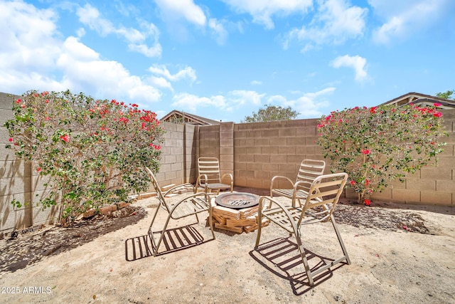 16917 W Sonora St, Goodyear, AZ 85338 - fenced backyard featuring a fire pit and a patio area