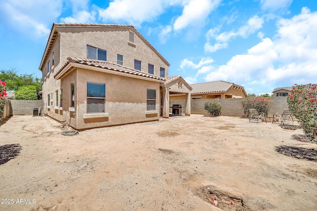 16917 W Sonora St, Goodyear, AZ 85338 - rear view of property featuring stucco siding, a tile roof, and a fenced backyard