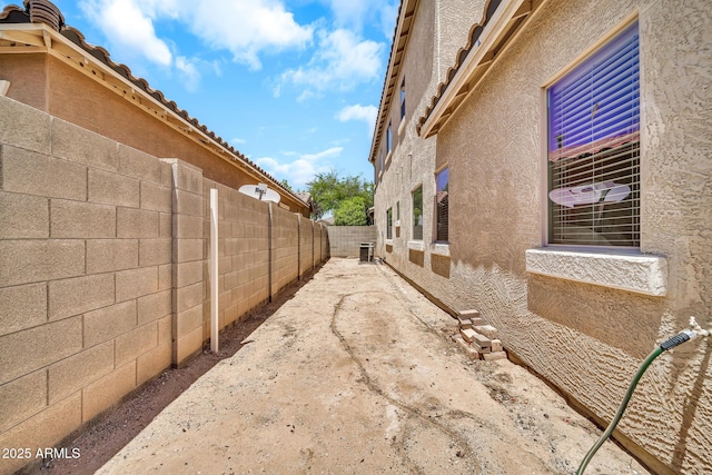 16917 W Sonora St, Goodyear, AZ 85338 - view of property exterior with stucco siding and a fenced backyard