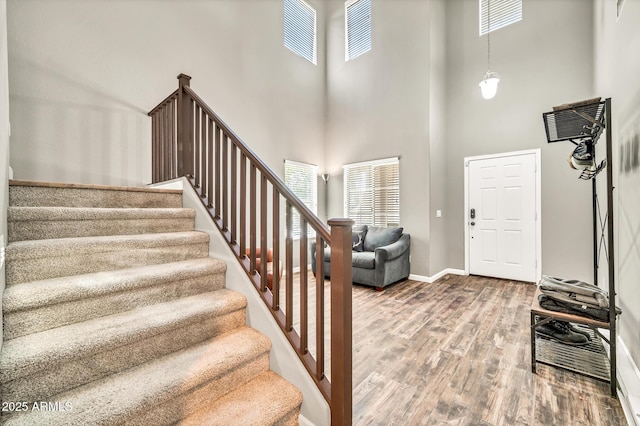 16917 W Sonora St, Goodyear, AZ 85338 - entryway featuring a high ceiling, wood finished floors, and stairs