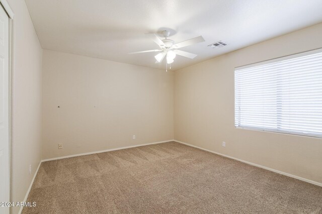 16847 S 13th Way, Phoenix, AZ 85048 - empty room with carpet, a ceiling fan, and baseboards