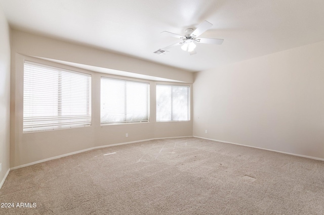 carpeted empty room with ceiling fan