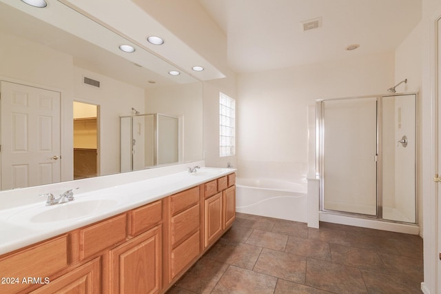 bathroom with shower with separate bathtub and vanity