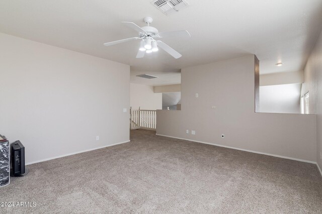 16847 S 13th Way, Phoenix, AZ 85048 - unfurnished living room with carpet flooring, a ceiling fan, and baseboards