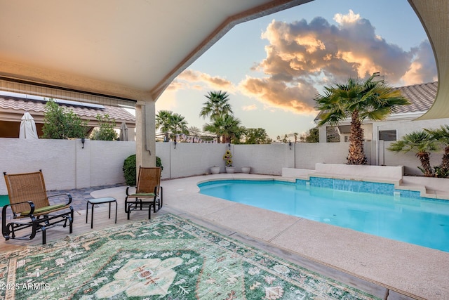 view of swimming pool featuring a patio area, a fenced backyard, and a fenced in pool