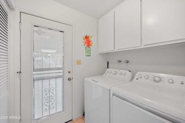 laundry room featuring cabinet space and washer and clothes dryer