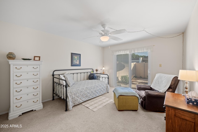 bedroom with access to exterior, ceiling fan, and light colored carpet