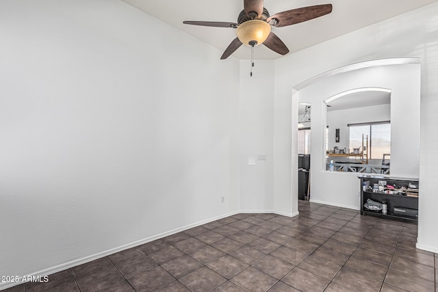 26264 N 74th Ln, Peoria, AZ 85383 - tiled empty room featuring arched walkways and a ceiling fan