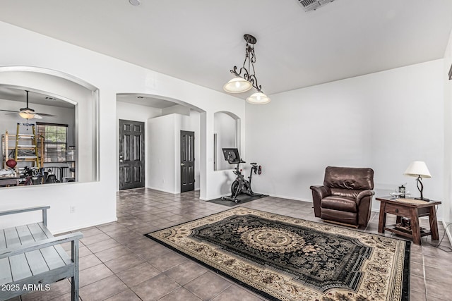 26264 N 74th Ln, Peoria, AZ 85383 - sitting room featuring arched walkways, ceiling fan, tile patterned floors, and baseboards