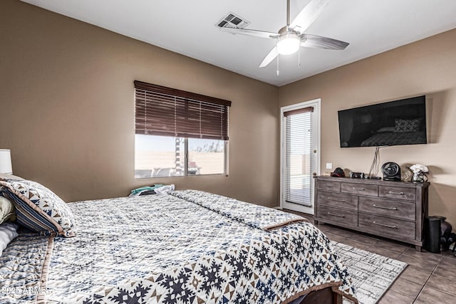 26264 N 74th Ln, Peoria, AZ 85383 - bedroom with tile patterned floors, ceiling fan, and access to outside