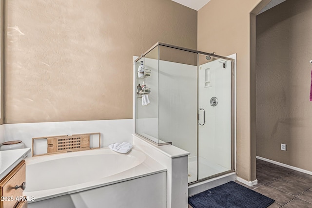 26264 N 74th Ln, Peoria, AZ 85383 - bathroom with a shower stall, a garden tub, tile patterned floors, and vanity