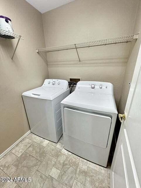 laundry area featuring separate washer and dryer