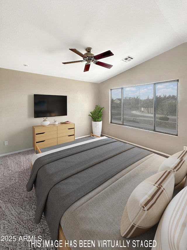 carpeted bedroom featuring lofted ceiling and ceiling fan