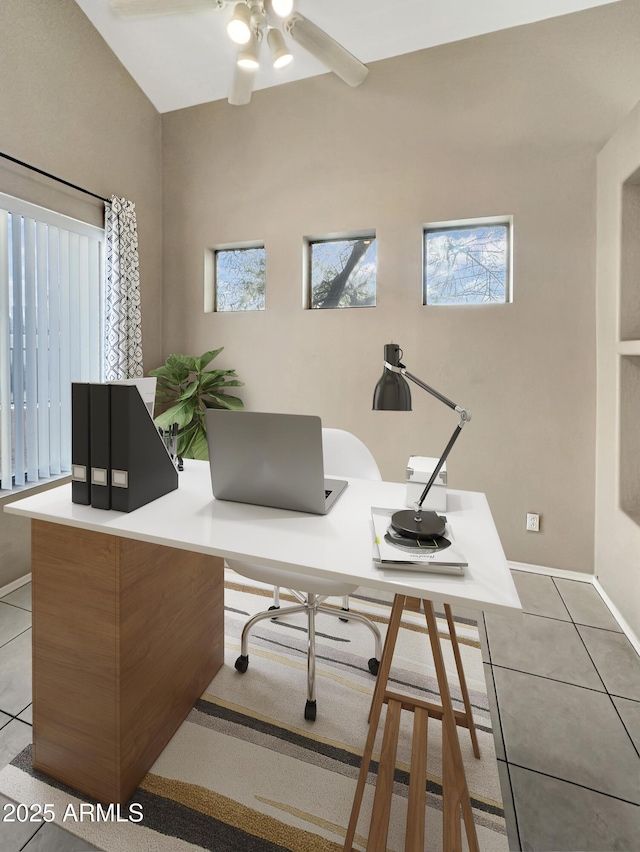 tiled office featuring ceiling fan