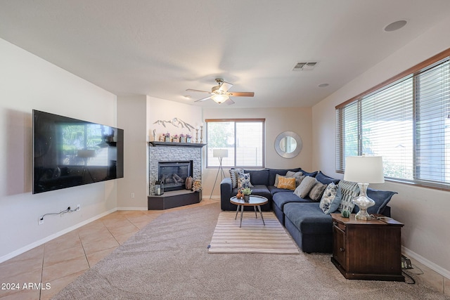14586 W Columbus Ave, Goodyear, AZ 85395 - living room featuring ceiling fan, tile patterned flooring, baseboards, and a glass covered fireplace