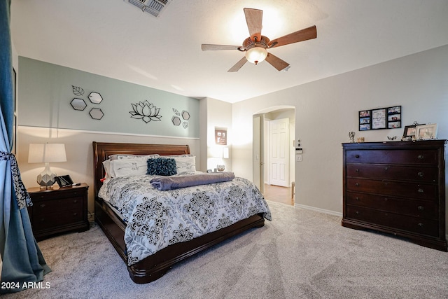 14586 W Columbus Ave, Goodyear, AZ 85395 - bedroom featuring carpet flooring, arched walkways, ceiling fan, and baseboards