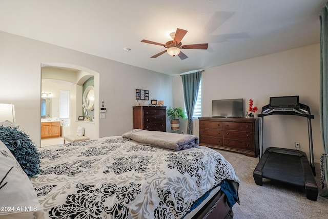 14586 W Columbus Ave, Goodyear, AZ 85395 - bedroom with carpet, multiple windows, a ceiling fan, and arched walkways