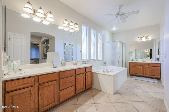 14586 W Columbus Ave, Goodyear, AZ 85395 - full bath with ceiling fan, a shower stall, a bath, two vanities, and tile patterned floors