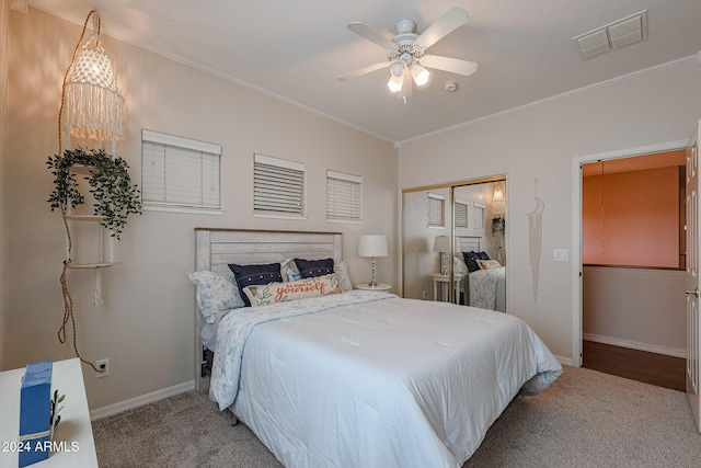 14586 W Columbus Ave, Goodyear, AZ 85395 - bedroom with carpet floors, ornamental molding, a closet, baseboards, and a ceiling fan