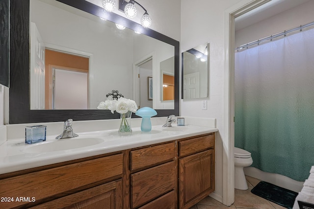 14586 W Columbus Ave, Goodyear, AZ 85395 - bathroom featuring tile patterned flooring, toilet, and double vanity
