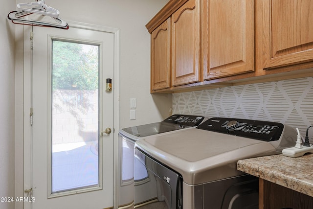 14586 W Columbus Ave, Goodyear, AZ 85395 - laundry room featuring cabinet space and washer and clothes dryer