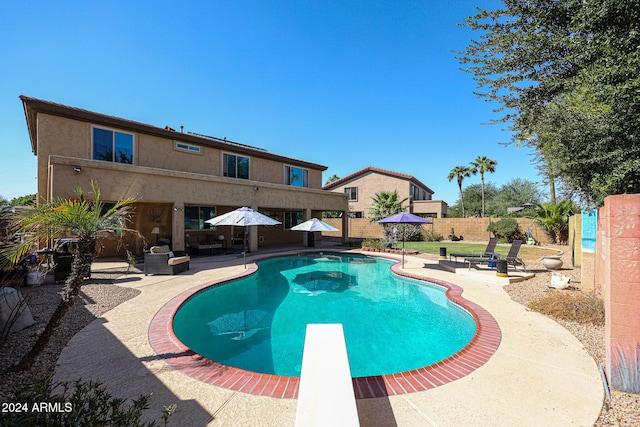 14586 W Columbus Ave, Goodyear, AZ 85395 - view of swimming pool featuring a patio, a diving board, and a fenced backyard