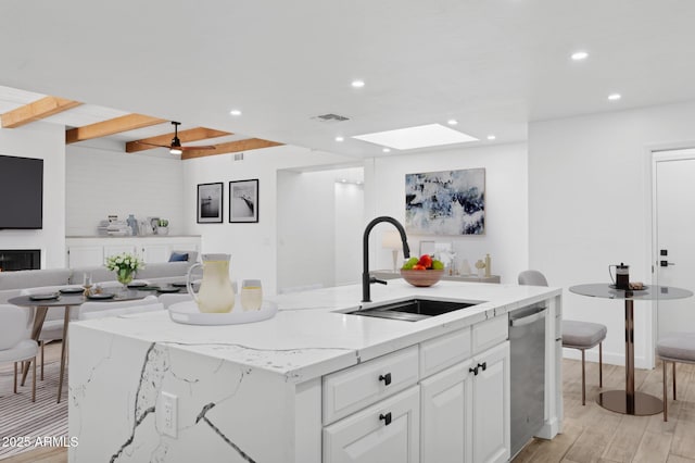 5756 N 78th Pl, Scottsdale, AZ 85250 - kitchen featuring a sink, dishwasher, open floor plan, recessed lighting, and light wood finished floors