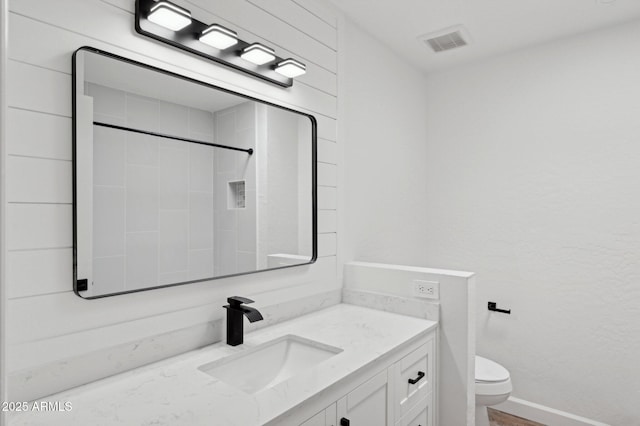 5756 N 78th Pl, Scottsdale, AZ 85250 - bathroom with toilet, vanity, and baseboards