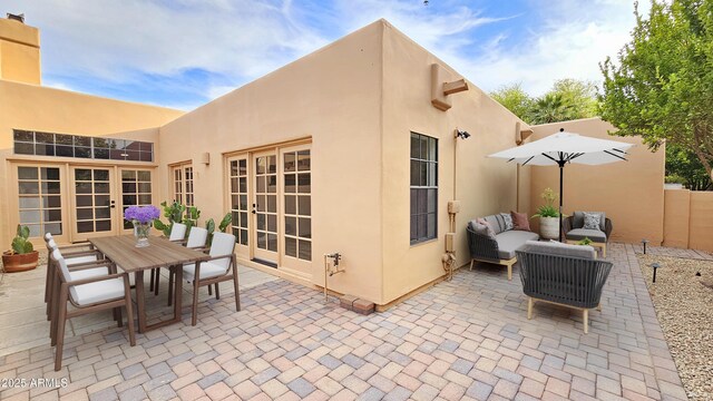 5756 N 78th Pl, Scottsdale, AZ 85250 - view of patio / terrace featuring french doors, an outdoor living space, and outdoor dining area