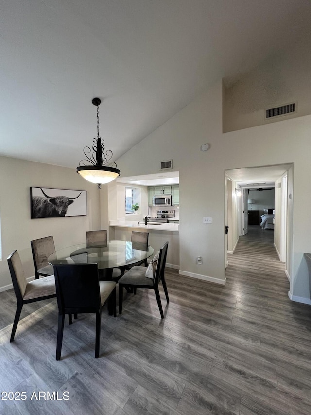 4040 N Weimer Pl Unit 4, Tucson, AZ 85719 - dining space with dark wood-style flooring, baseboards, and visible vents