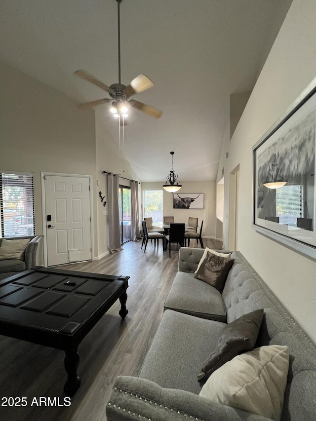 4040 N Weimer Pl Unit 4, Tucson, AZ 85719 - living room with lofted ceiling, baseboards, ceiling fan, and wood finished floors