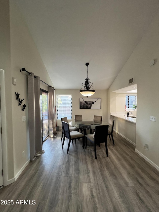 4040 N Weimer Pl Unit 4, Tucson, AZ 85719 - dining room featuring baseboards, visible vents, and dark wood-style floors