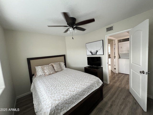 4040 N Weimer Pl Unit 4, Tucson, AZ 85719 - bedroom with baseboards, visible vents, dark wood finished floors, and stacked washer / drying machine