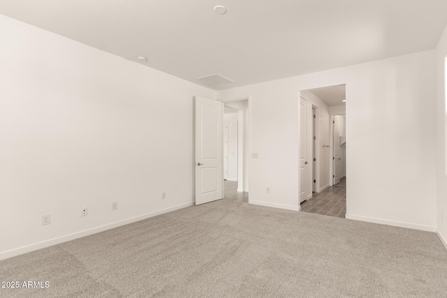 12369 W Marguerite Ave, Avondale, AZ 85323 - unfurnished bedroom featuring baseboards and carpet flooring