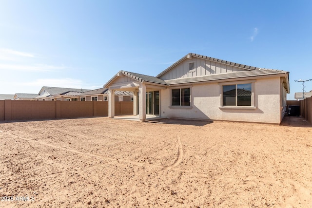 12369 W Marguerite Ave, Avondale, AZ 85323 - back of property featuring a patio area, a fenced backyard, a tile roof, and stucco siding