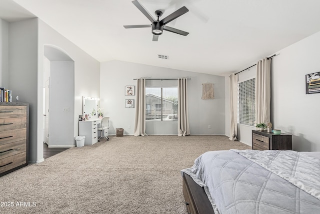 12376 W Hazelwood St, Avondale, AZ 85392 - carpeted bedroom with lofted ceiling, baseboards, visible vents, ceiling fan, and arched walkways