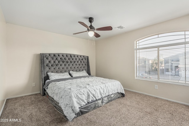 12376 W Hazelwood St, Avondale, AZ 85392 - carpeted bedroom featuring baseboards, a ceiling fan, and visible vents