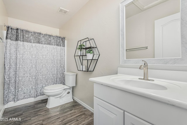 12376 W Hazelwood St, Avondale, AZ 85392 - full bath featuring visible vents, baseboards, toilet, vanity, and wood finished floors