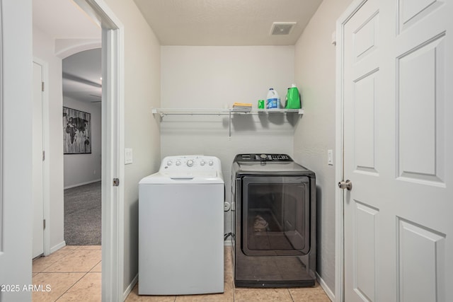 12376 W Hazelwood St, Avondale, AZ 85392 - clothes washing area featuring laundry area, visible vents, light tile patterned flooring, washing machine and clothes dryer, and baseboards