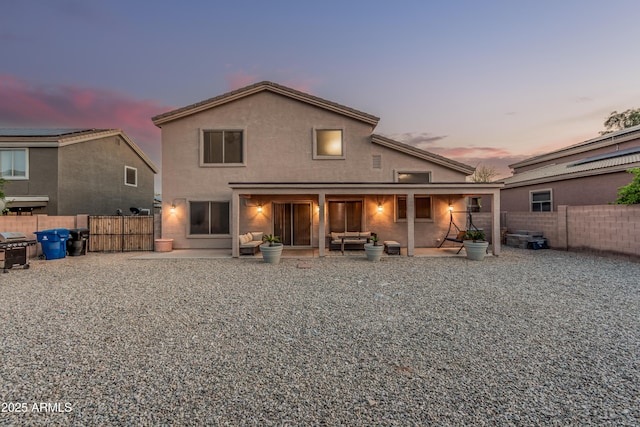 12376 W Hazelwood St, Avondale, AZ 85392 - rear view of house with a patio area, a fenced backyard, a gate, and stucco siding