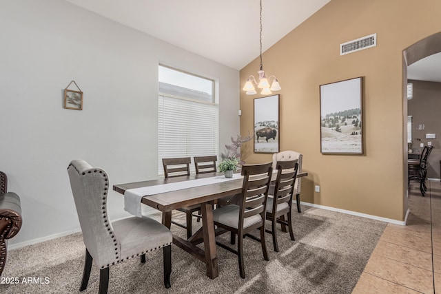 12376 W Hazelwood St, Avondale, AZ 85392 - tiled dining room with baseboards, high vaulted ceiling, a notable chandelier, and visible vents