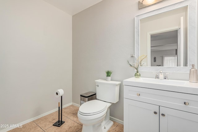 12376 W Hazelwood St, Avondale, AZ 85392 - half bath featuring tile patterned floors, toilet, vanity, and baseboards