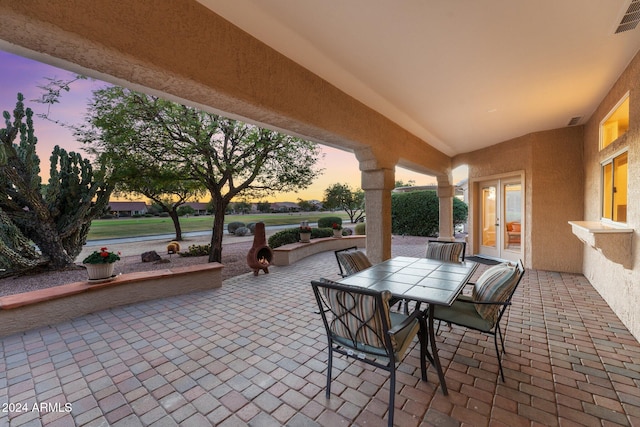 patio terrace at dusk with french doors