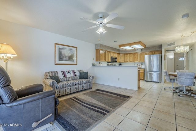 living area featuring light tile patterned floors and ceiling fan