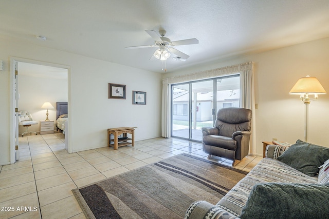living room with light tile patterned floors and a ceiling fan