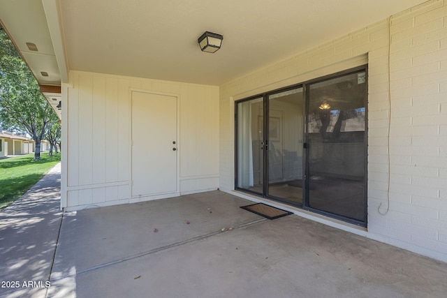 doorway to property with a patio