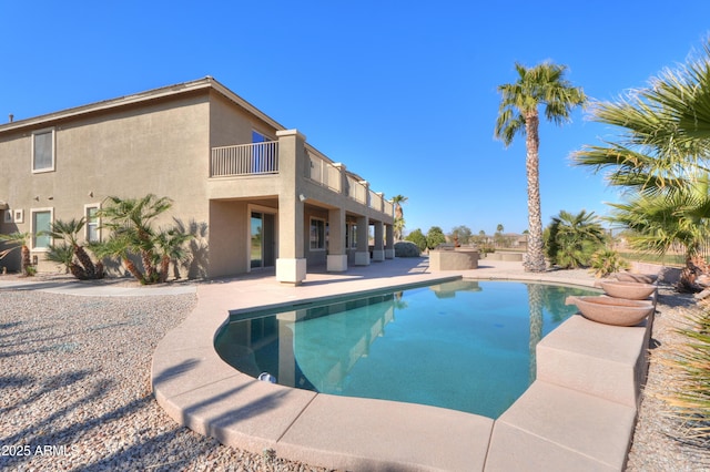 view of swimming pool with a patio area